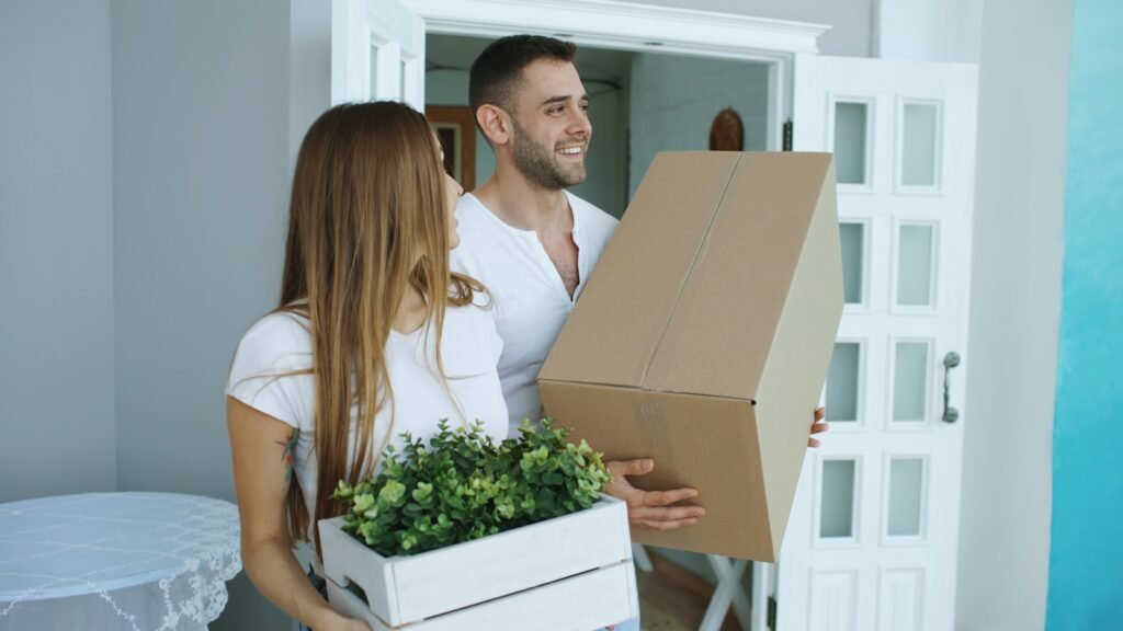 Movers carrying boxes into a new home in Dubai